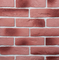 Abstract background and red, orange brick in masonry close-up