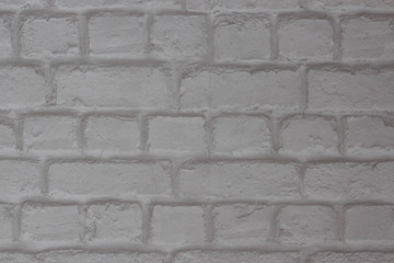 Abstract background of white brick in the masonry close-up