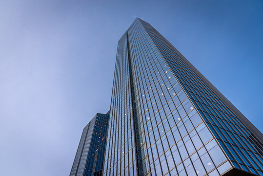 Calgary, Alberta - December 20, 2019: Looking up 8th Avenue Place office tower complex in Calgary, Alberta Canada. Calgary is the centre of Canada's oil and gas industry.
