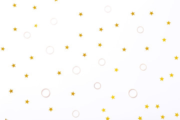 Beautiful background with golden rings and stars, top view