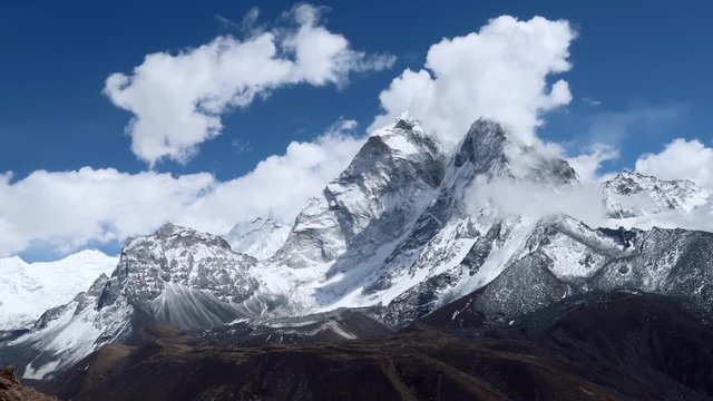 Clouds moving over the beautiful mountain Ama Dablam in the Everest Region of the Himalayas, Nepal