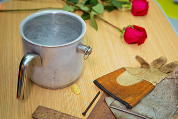 Chemical experiment, show with liquid nitrogen . researcher in uniform is conducting an experiment with liquid. Rose, gloves . Steam of Nitrogen Created from Liquid Nitrogen Exposed to Temperatures .
