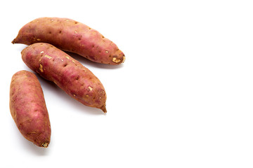 japanese sweet potatoes on white background
