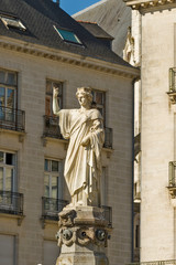 Fototapeta na wymiar The city of Nantes is represented by a white marble statue with the features of a crowned woman, holding a trident: it is Amphitrite, goddess of the sea and wife of Poseidon