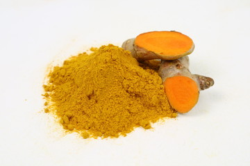 Turmeric powder and turmeric root extract on a white background, used as a tonic for body and food ingredients.