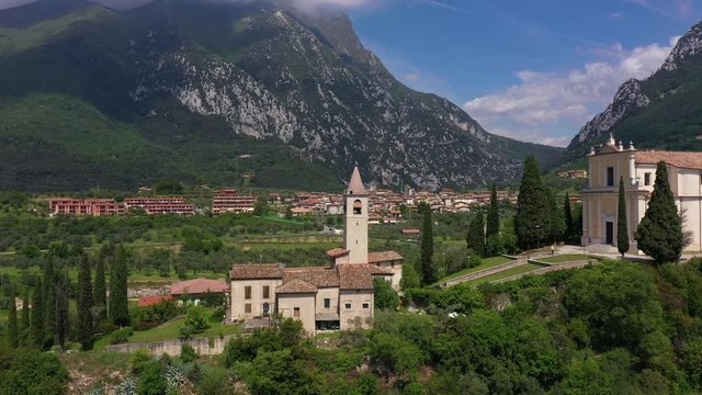 Aerial view, church Chiesa di San Michele Arcangelo, Italy. In the background Lake Garda