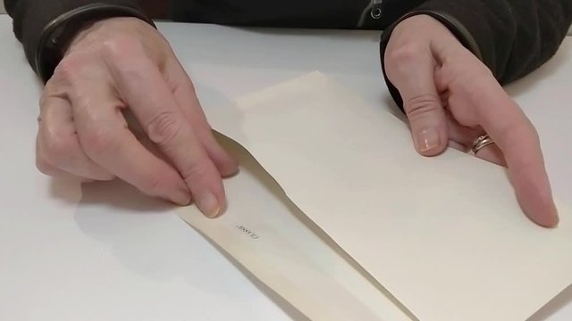 Woman opens an envelope with money