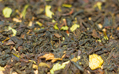 green tea leaves on wooden background