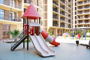 Children kids playground with play equipment outdoor. Kids playground with slides in the park. play...