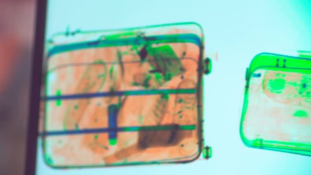 Various personal items scanned in the x-ray airport security checkpoint