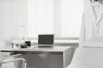 Doctor's workplace near window in medical office