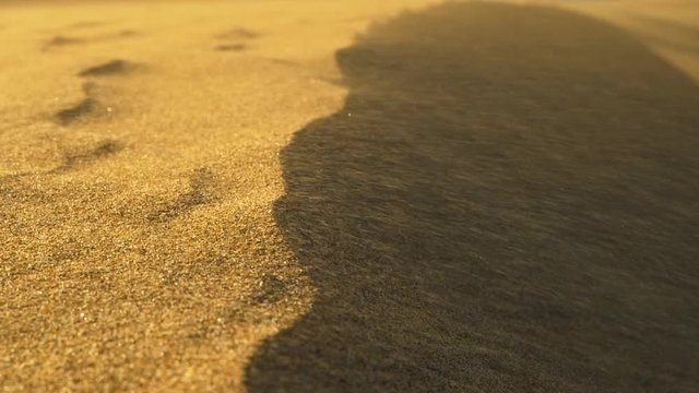Sand storm in desert. Sand blowing over sand dunes in the wind