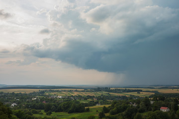 Scenic landscape with storm clouds and rain. Summer thunderstorm
