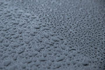 raindrops on a black background. Texture of drops on a dark background. Anti-rain for cars