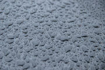 raindrops on a black background. Texture of drops on a dark background. Anti-rain for cars