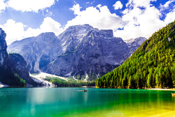 Fototapeta na wymiar Lake Braies (also known as Pragser Wildsee or Lago di Braies) in Dolomites Mountains, Sudtirol, Italy. Romantic place with typical.