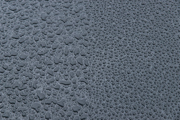 raindrops on a black background. Texture of drops on a dark background. Anti-rain for cars