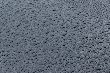 raindrops on a black background. Texture of drops on a dark background. Anti-rain for cars