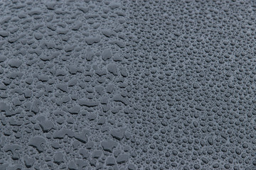 raindrops on a black background. Texture of drops on a dark background. Anti-rain for cars