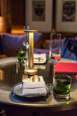 Champagne glass with plate and napkin on the table