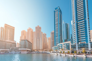 Fototapeta na wymiar Panoramic view of the Marina district with numerous residential skyscrapers and hotels. Travel destinations in the UAE concept