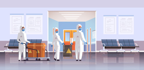 people in protective hazmat suits carrying barrels with warning sign 2019-nCoV flu outbreak china pathogen respiratory MERS-CoV quarantine coronavirus concept hospital interior horizontal vector