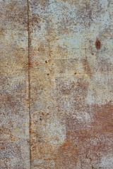 Brown worn, scratched, rusty metal background textures. Grunge, abstraction, design. Space for text. Vertical.