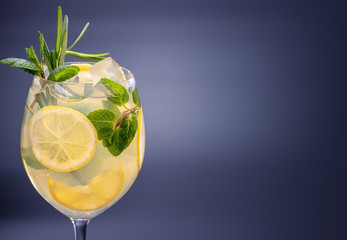 Glass of fresh lemonade with lemon lime grapefruit mint crashed ice. Summer healthy sweet Mojito cocktail of citrus infused waters, diet detox beverages