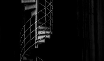 Black and white dark circular stairway