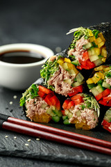 Vegetarian paleo diet nori wraps with tuna, cucumber, sweet pepper and microgreen radish sprouts