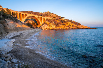 Beach and old railway bridge at Carry le Rouet France - obrazy, fototapety, plakaty