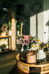 Candle and flowers in the sun 