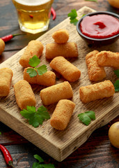 Homemade Potato Croquettes with dipping sauce on wooden board