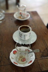 Empty cups from tea and coffee left at traditional coffee shop at Turkey