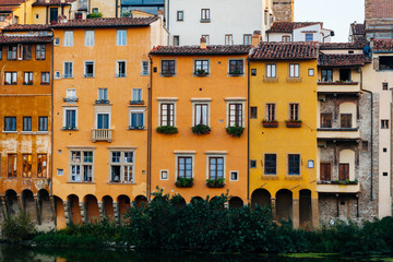 Fototapeta na wymiar Colorful facades of the old houses in center of Florence, Italy