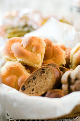 Assortment of bread and rolls served in a basket