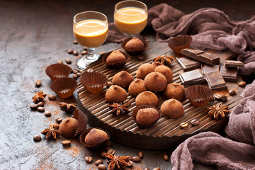  Sweet chocolate candy with liqueur in glass, dessert table