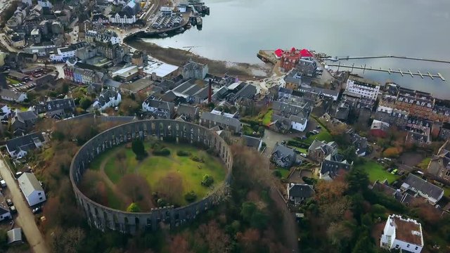Flying over the Coliseum in Oban, Scotland and tilting up toward Oban Bay.