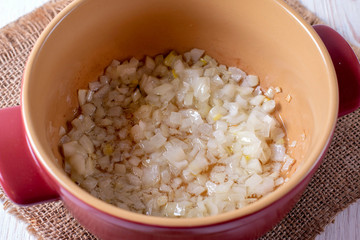 Fried onions in a ceramic pot