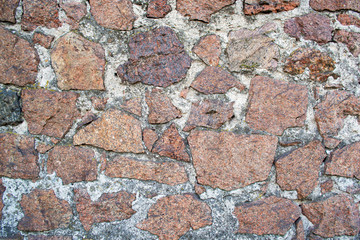  Background wall masonry of red granite stone