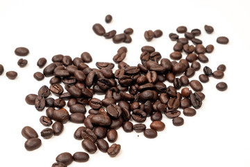 A handful of coffee beans on a white background