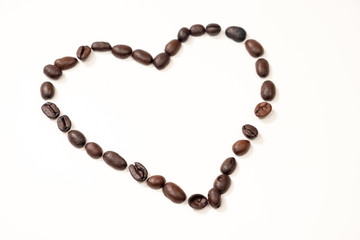 Heart of coffee beans on a white background