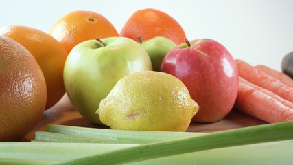 fresh fruits and vegetables on wooden board 