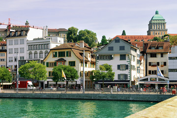 Obraz premium Zurich, Switzerland - September 2, 2016: University of Zurich, Switzerland. Seen at Limmat River embankment. People on the background