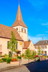 Beautiful church on square in picturesque Kientzheim village, Alsace wine region, France
