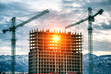 construction site with cranes and buildings