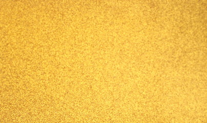 Fototapeta premium Defocused abstract gold, yellow, light brown lights background. Space. Wallpaper. Abstract glitter bokeh on black background