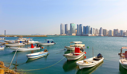 Bahrain, Manama, View of Tall Buildings and Fishing Boats