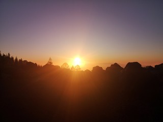 sunset in canary islands with silhouetted landscape