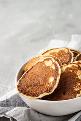 Homemade classic American pancakes in a ceramic bowl, copy space for text. Healthy breakfast.